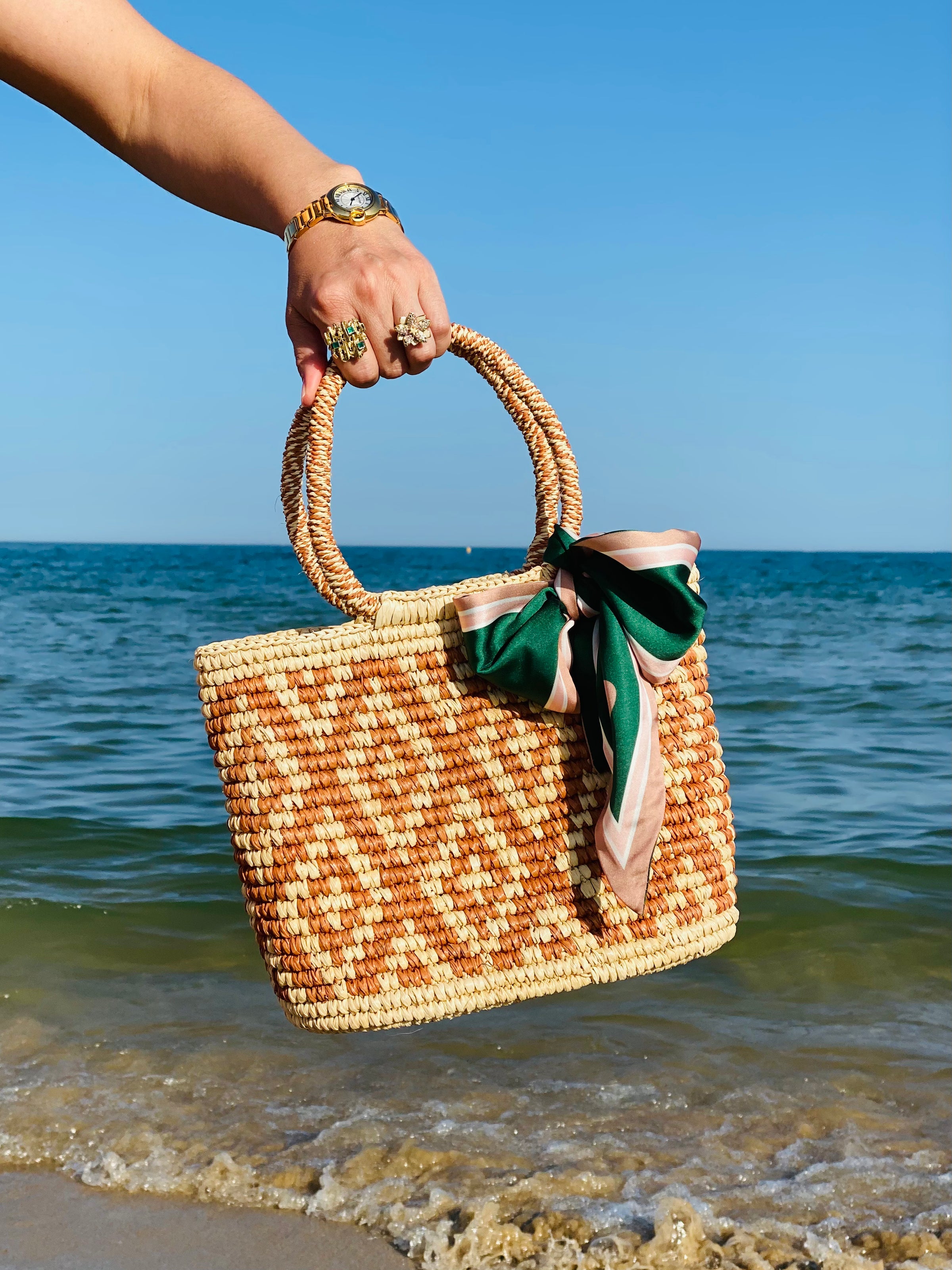Luxury handwoven straw handbag made from fine Ecuadorian toquilla palm with leather handles for summer resort wear by Marchesi di Montecristi UK