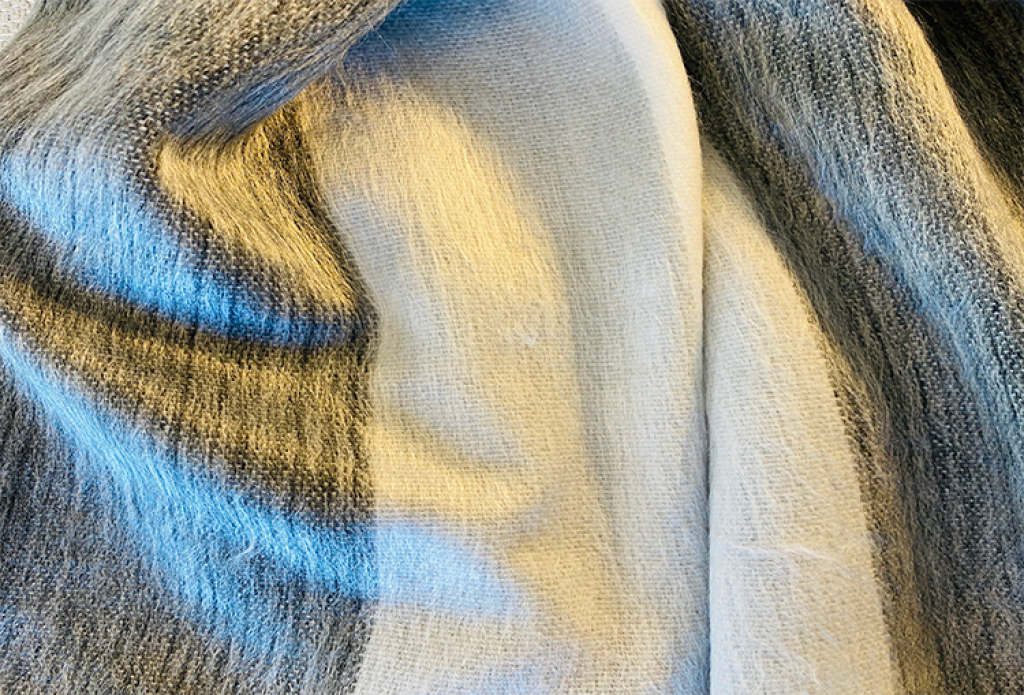 Ultra soft baby alpaca wool shawl and scarf wrap handcrafted in natural Andean fiber for luxury winter travel by Marchesi di Montecristi UK
